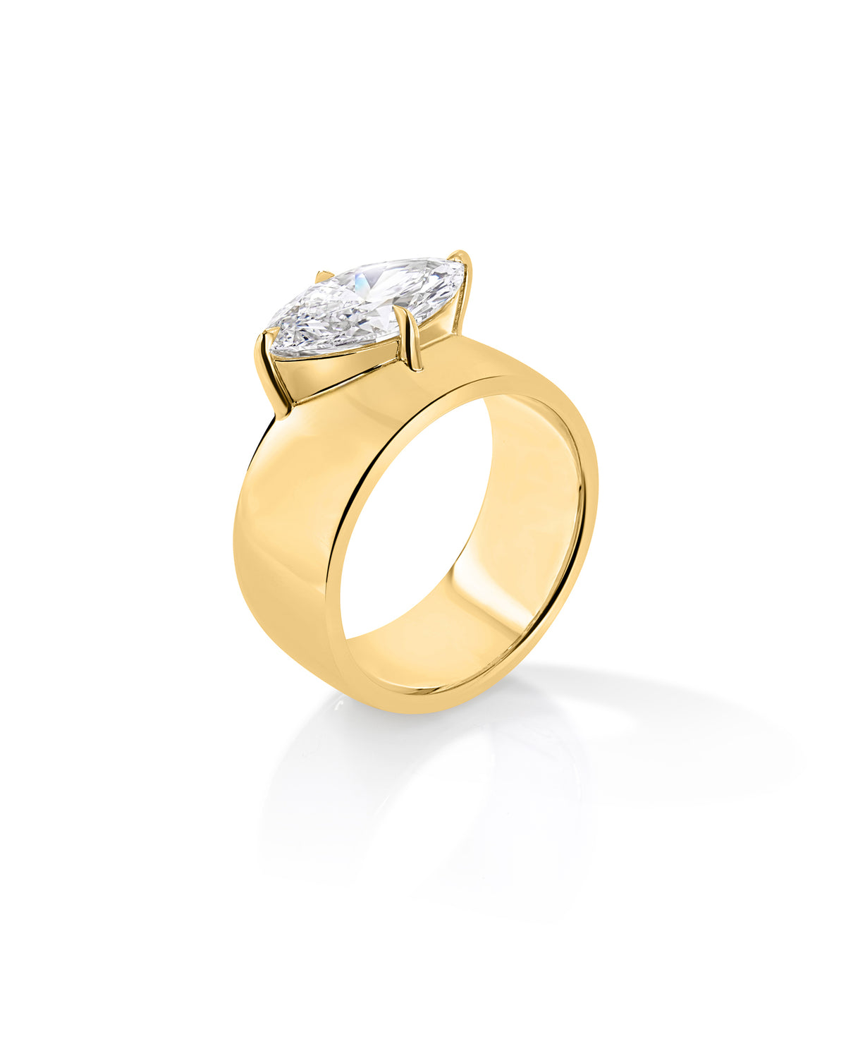 Angled side view of The Eclipse ring with a marquise-cut diamond in a raised setting on a wide 14K yellow gold half-dome band. 67586767814744