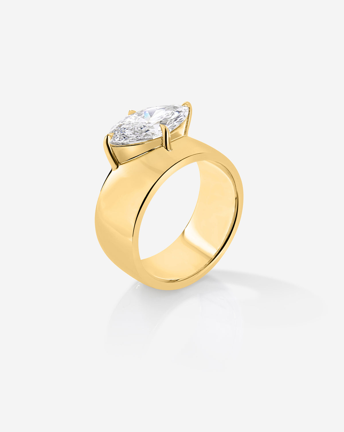Angled side view of the Eclipse ring with a 2.09-carat marquise lab-grown diamond in a raised prong setting above a wide yellow gold band.