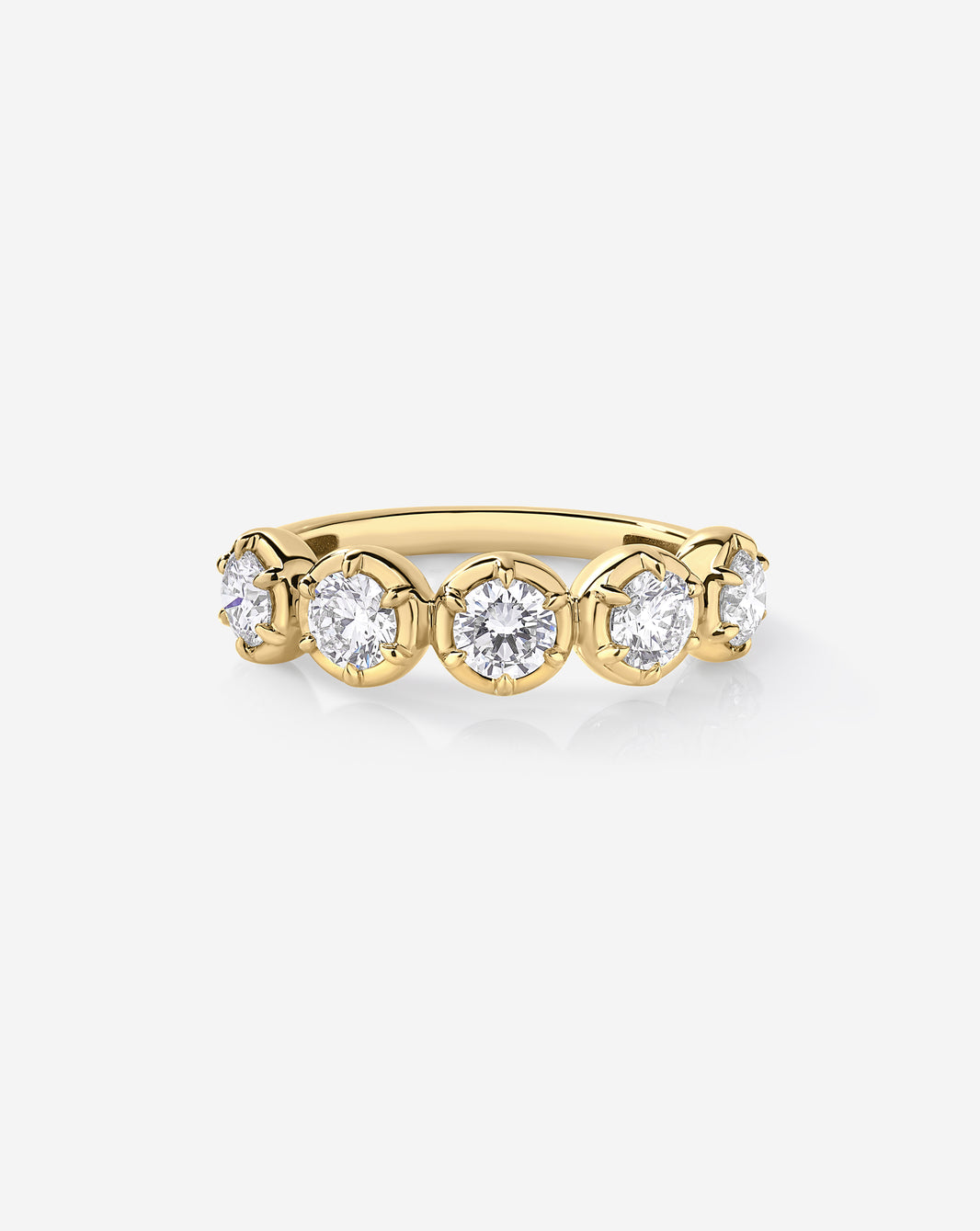A yellow gold band ring featuring five round-cut lab diamonds in a row, set in a classic prong setting against a clean white background.