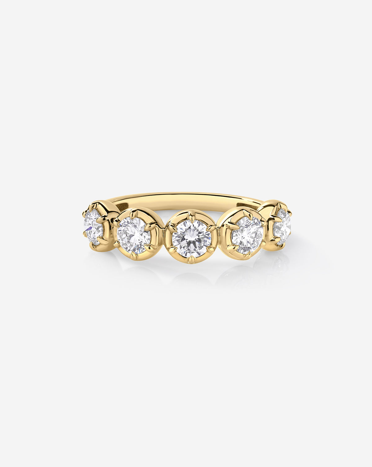 A yellow gold band ring featuring five round-cut lab diamonds in a row, set in a classic prong setting against a clean white background.