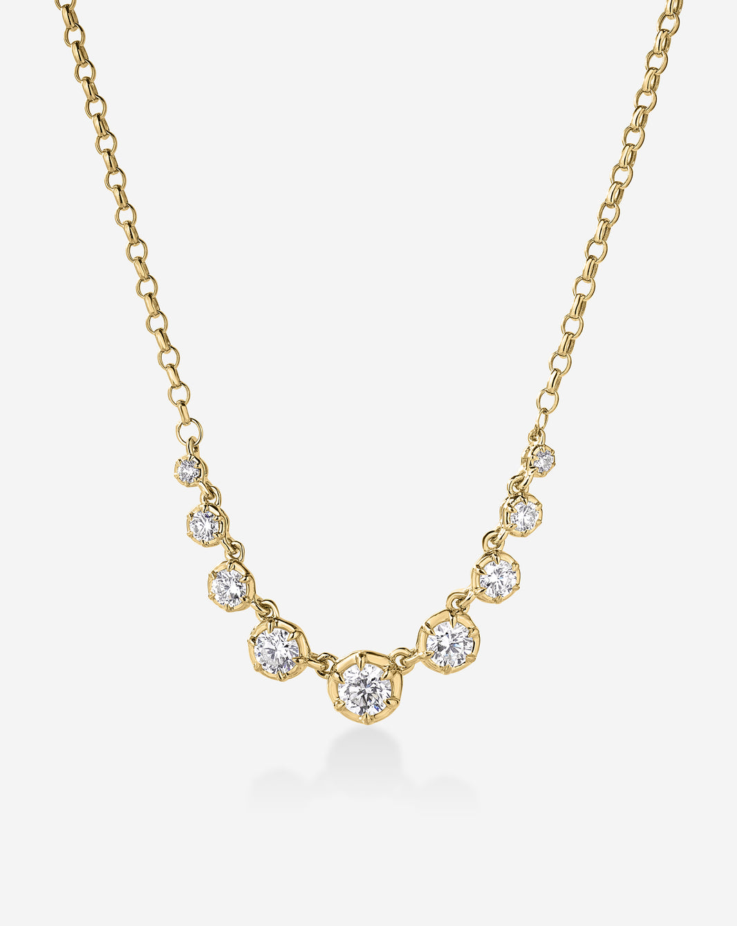 14k Yellow gold cable chain necklace featuring a row of graduated round-cut diamonds, largest stone centered at the front. 