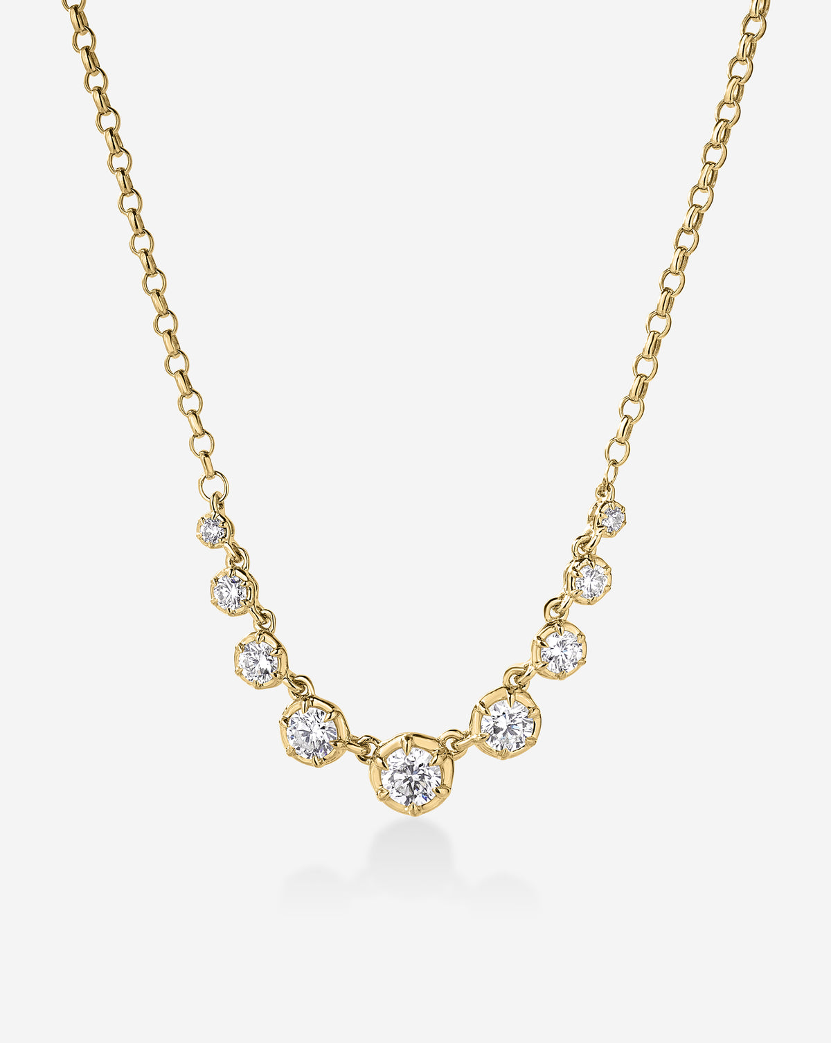 14k Yellow gold cable chain necklace featuring a row of graduated round-cut diamonds, largest stone centered at the front. 