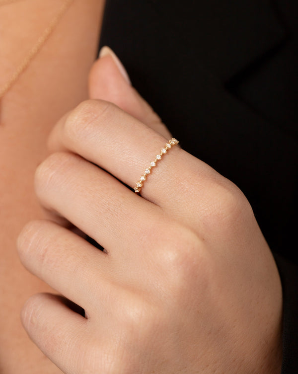Close up image of the diamond station stackable ring on pointer finger