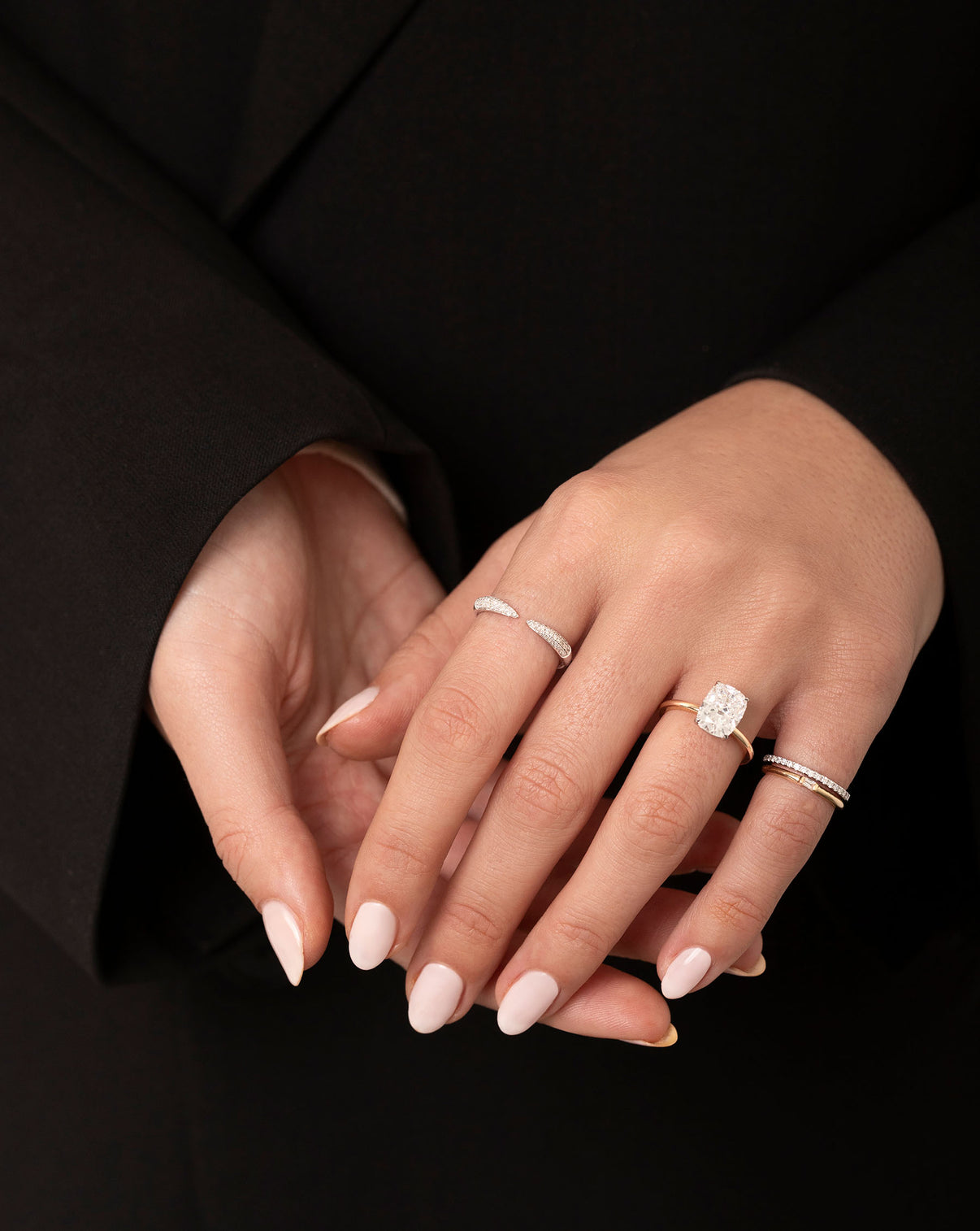 Model wearing Triple Row Diamond Claw Ring, Engagement Ring, Single Baguette Ring and Stackable Pave Diamond Ring