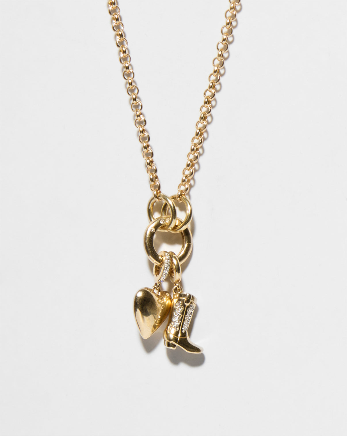 Flat lay of chain with enhancer and charms