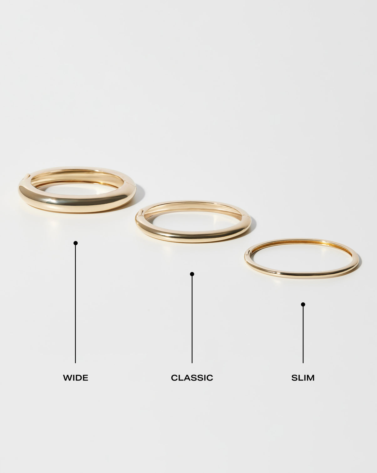 size comparison of stackable gold cloud bangles slim, classic and wide