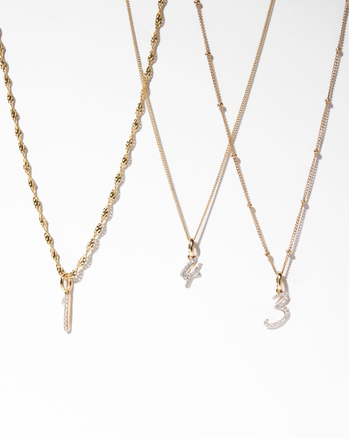 Diamond number pendant on chain necklace on multiple different chains