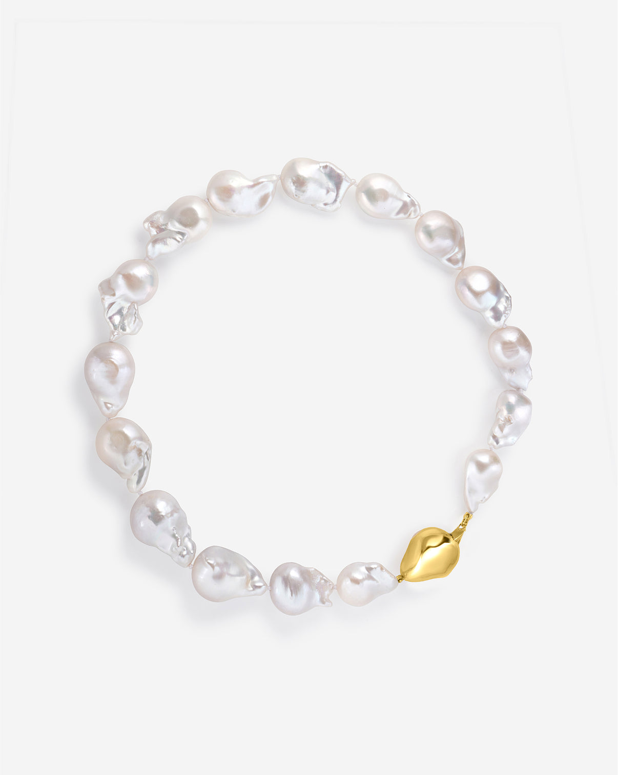 Overhead view of Baroque Pearl Necklace with matching summer collection pieces