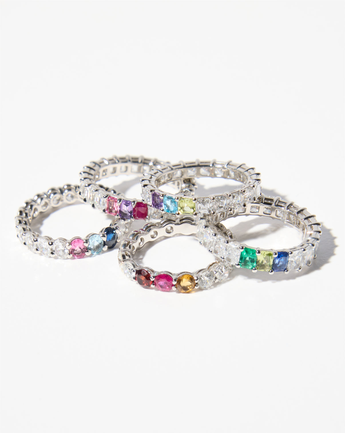 Diamond and Birthstone Eternity Bands with several diamond and multi colored birthstone bands against a white background Diamond and Birthstone Eternity Band Petite Classic Luxe Platinum 14k Yellow Gold 14k Rose Gold