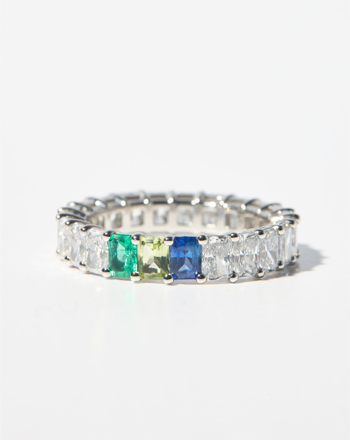 Radiant Diamond and Birthstone Eternity Band against white background platinum