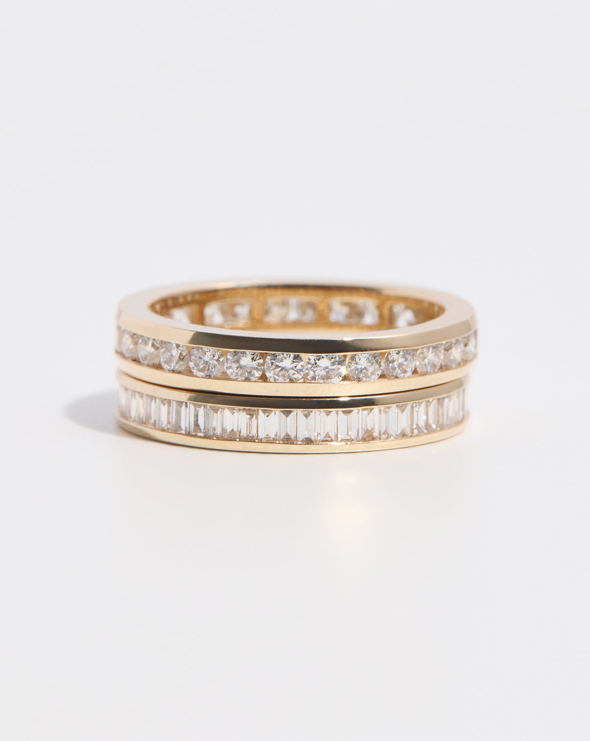 Round Diamond Channel Set Band ring in 14K Yellow Gold stacked with Baguette Diamond Channel Set Band ring in 14K Yellow Gold
