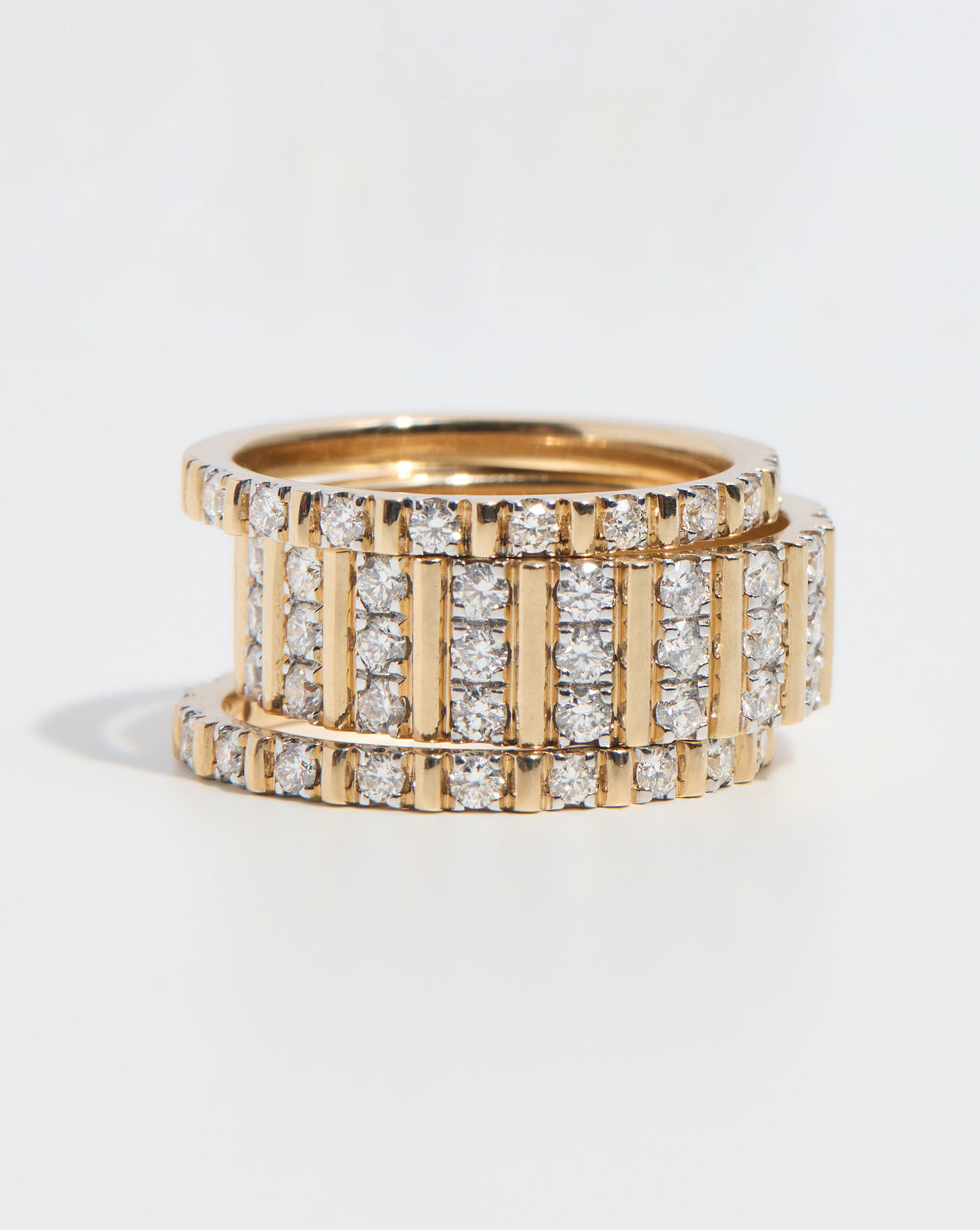 Fluted Diamond Ring and 3 Row Fluted Diamond Ring stacked on top of each other on white background global