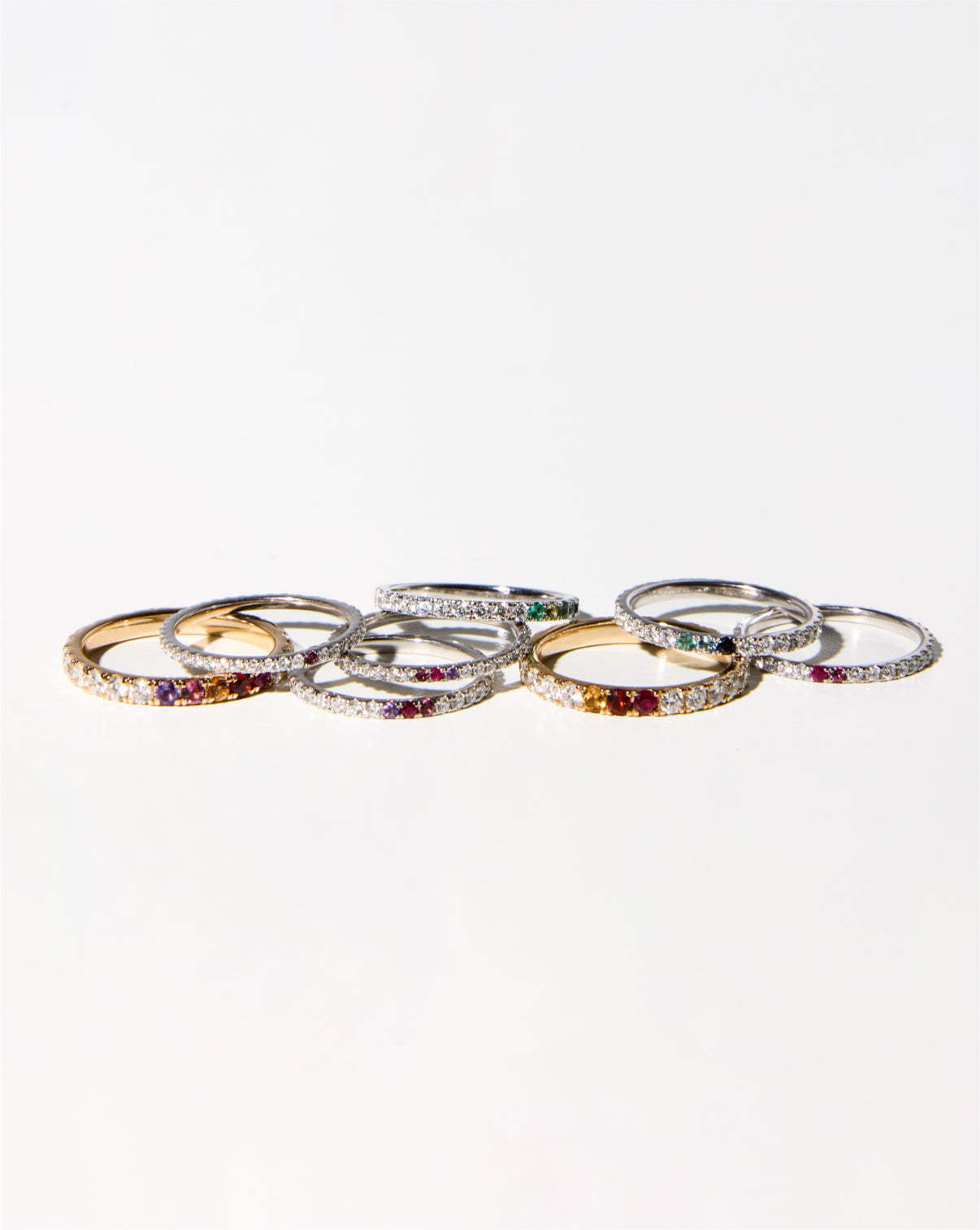 Personalized Perfect Pavé Diamond Rings stylized flat lay showing yellow and white gold GLOBAL