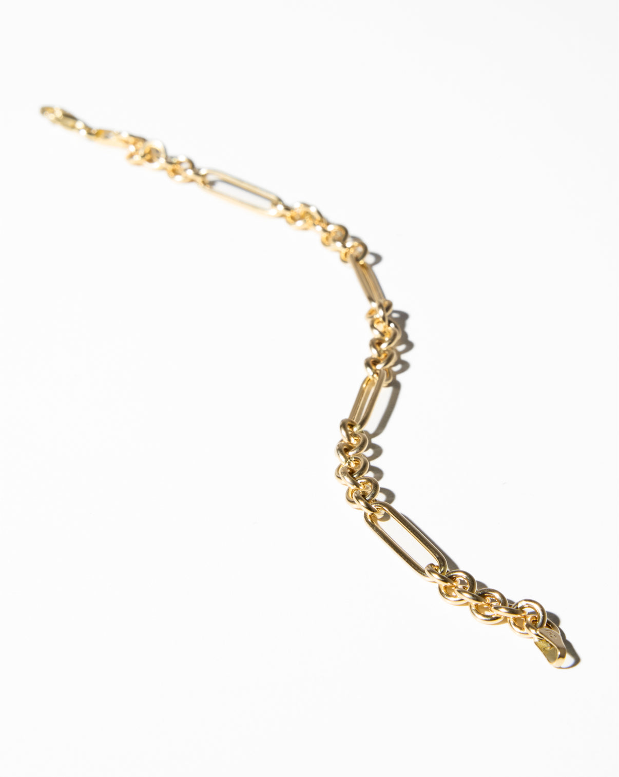 Mixed Link Chain Bracelet in a stylized flat lay on white background