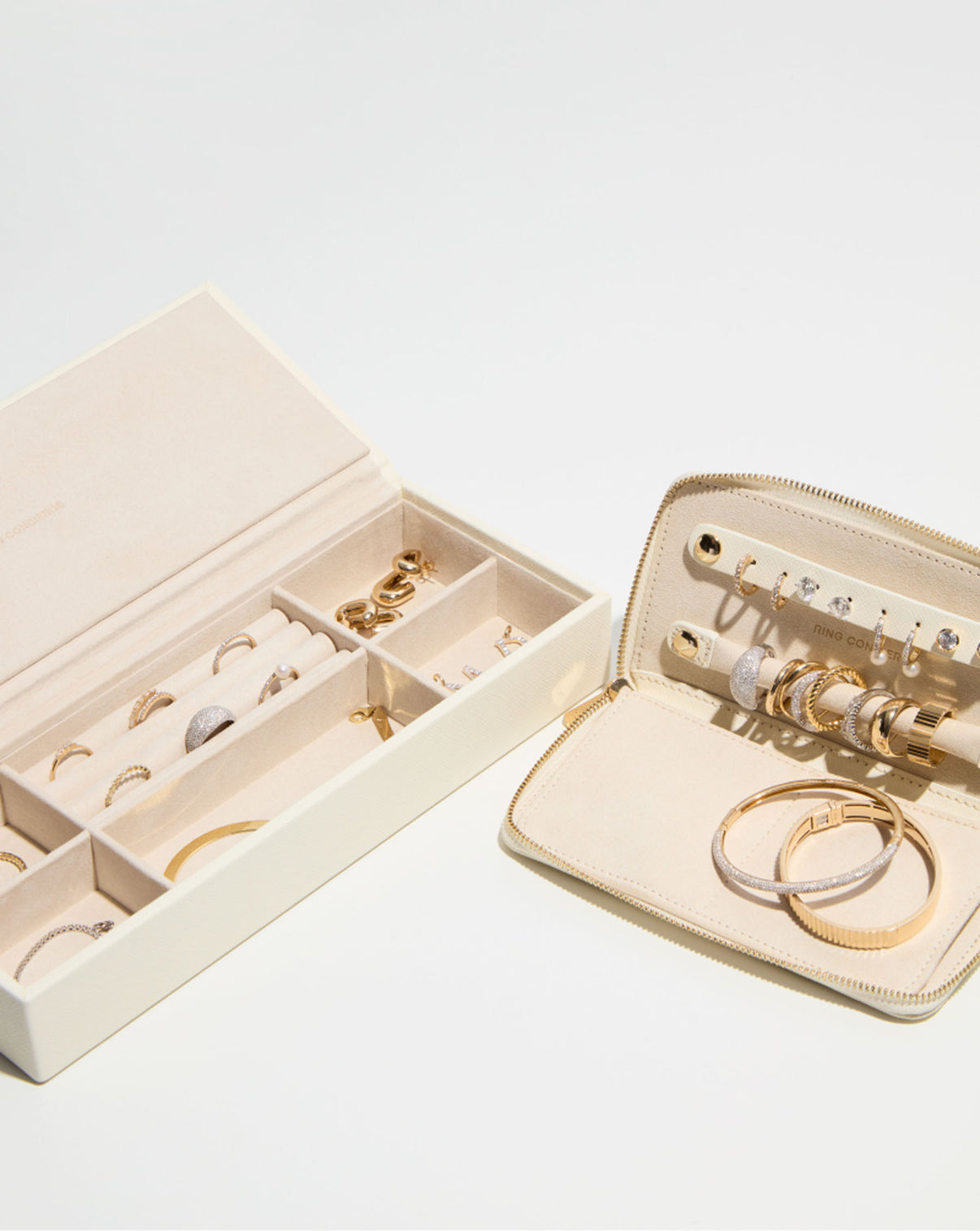 Leather Jewelry Box bird's eye angle with jewelry in compartments and Leather Travel Portfolio with jewelry inside