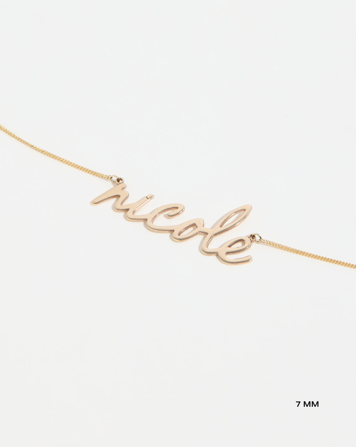 Personalized Script Name Necklace 7 mm yellow gold on white background