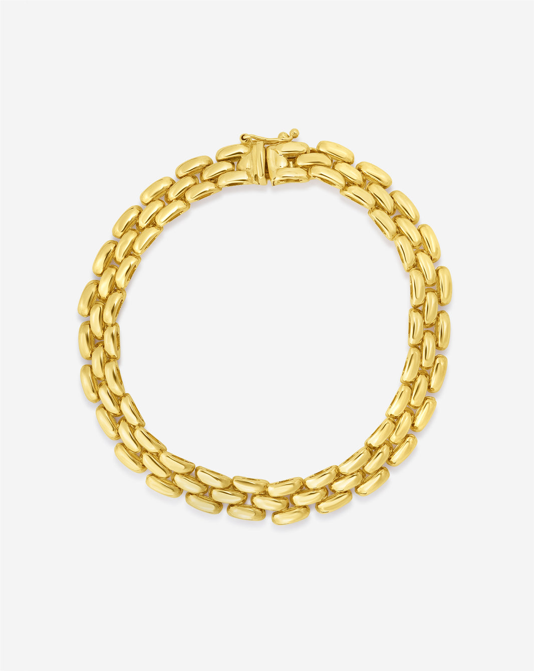 still life image of chain bracelet in yellow gold