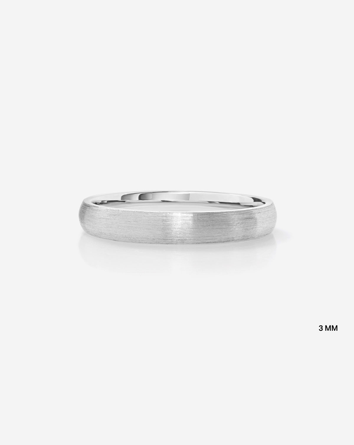 A minimalist 3mm brushed metal band ring in 14k white gold shown from a side profile on a clean white background with a subtle reflection.