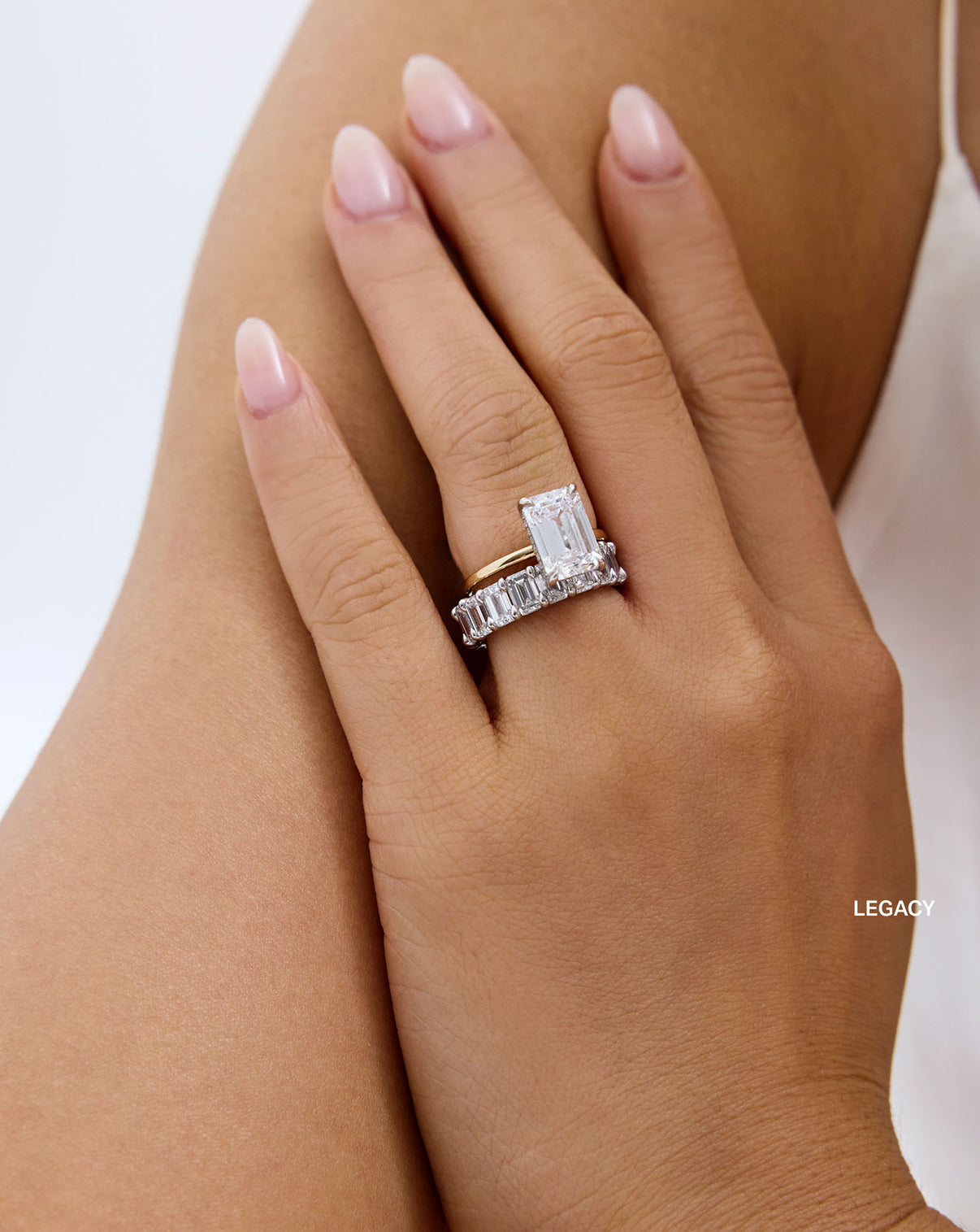 emerald band on-model with engagement ring legacy global