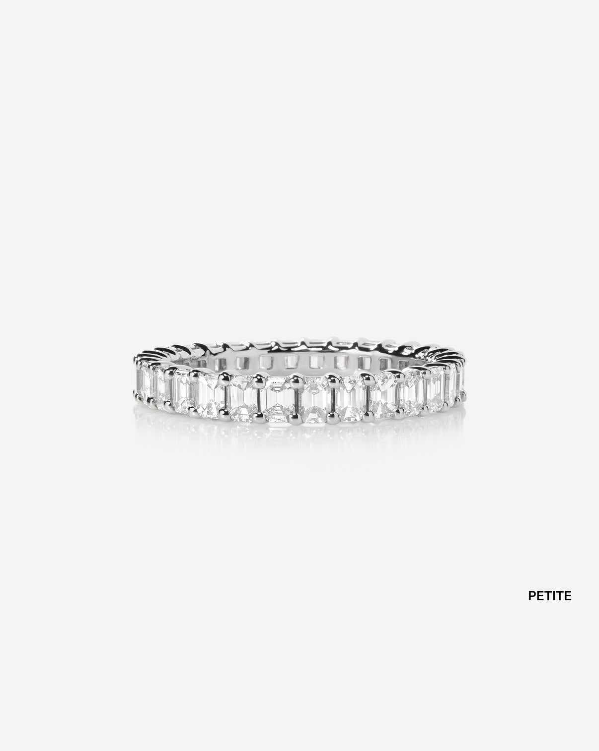petite wedding band against white background platinum