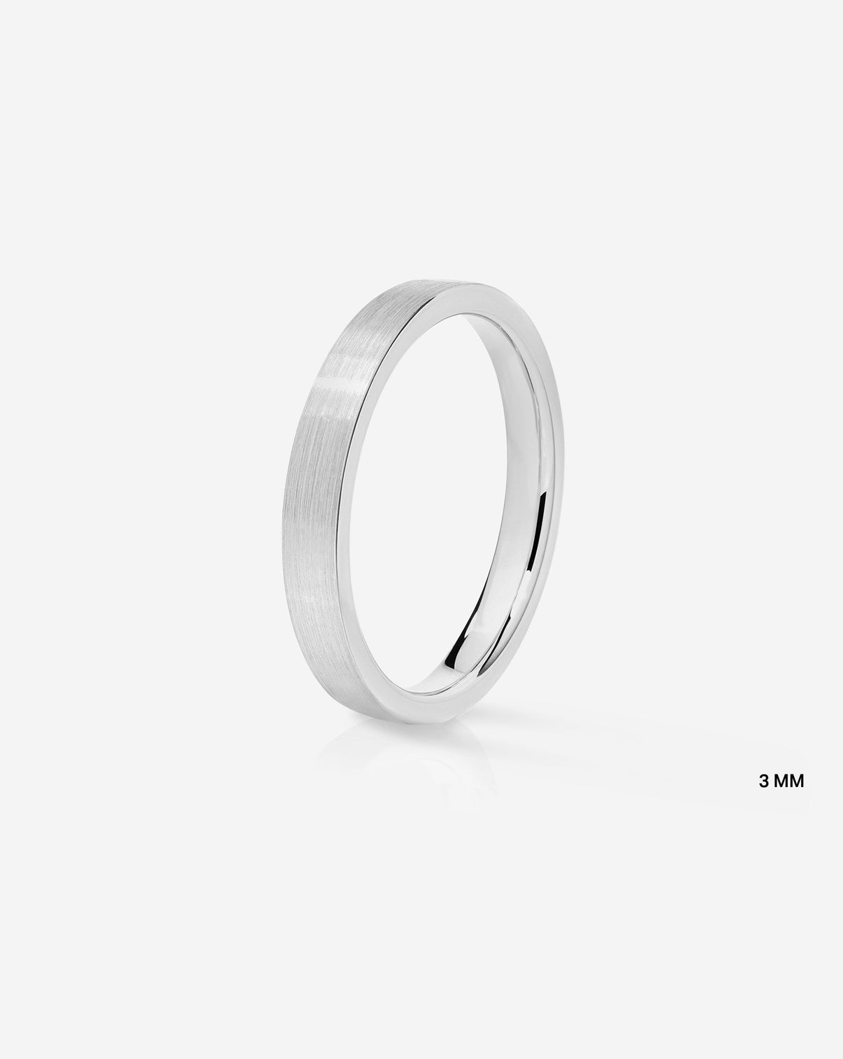 A minimalist 3mm 14k white gold band ring with a brushed satin finish, shown on a clean light gray background with a small '3 MM' text overlay in the bottom right.