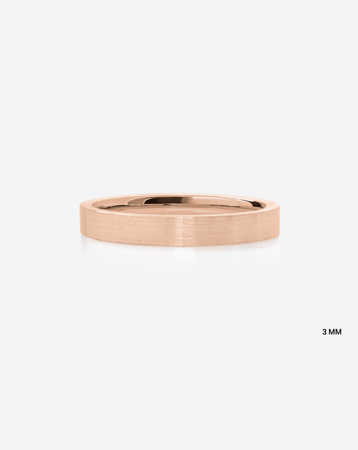 A minimalist 14k rose gold band ring with a satin finish shown on a light gray background with a small '3 MM' text overlay in the bottom right.