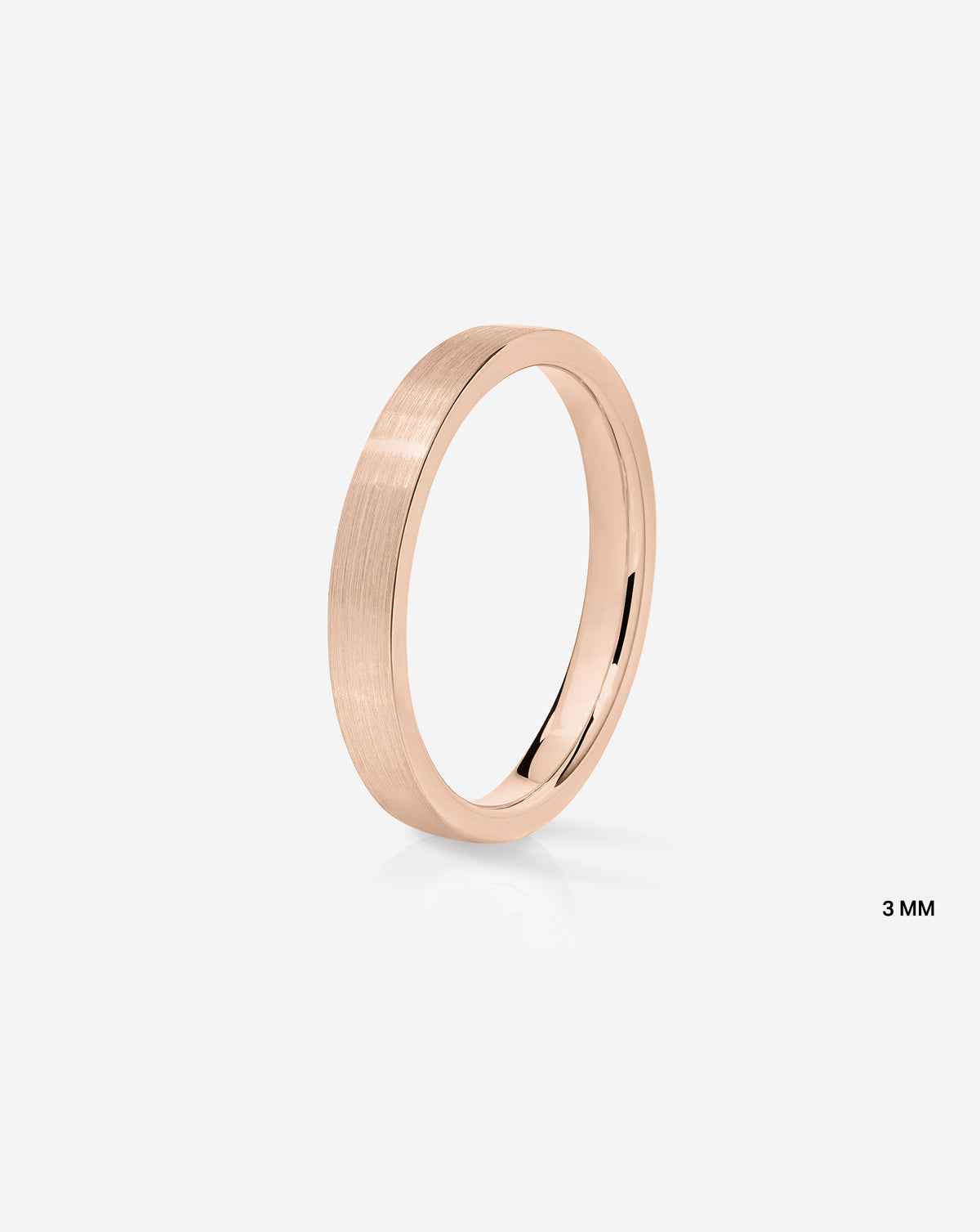 A minimalist 14k rose gold band ring with a satin finish side view shown on a light gray background with a small '3 MM' text overlay in the bottom right.
