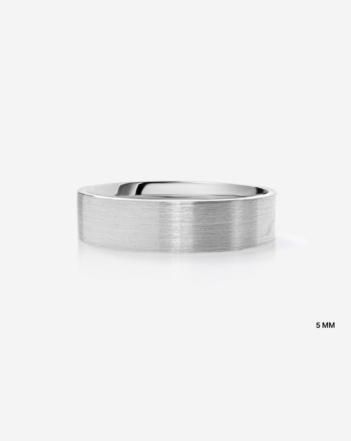 A minimalist 5mm brushed metal band ring in platinum, shown from front view on a clean white background with a subtle reflection.
