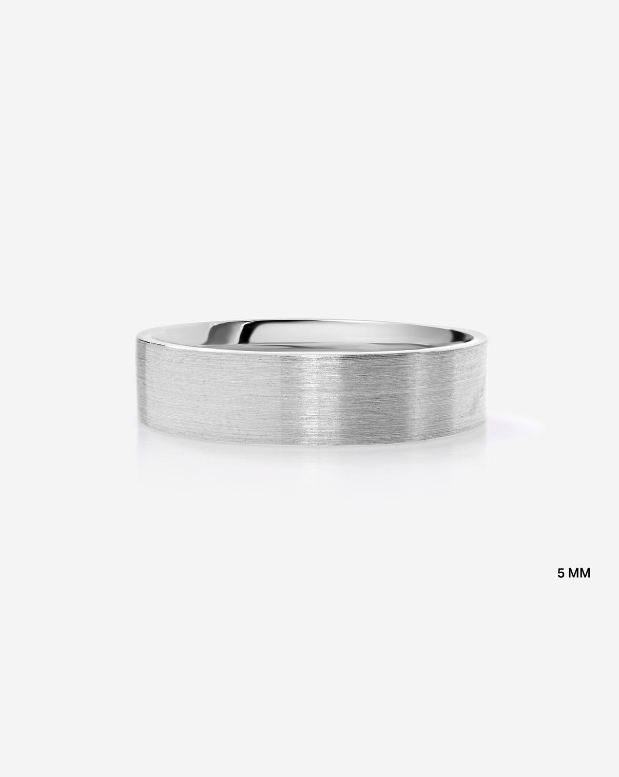A minimalist 5mm brushed metal band ring in 14k white gold shown from a side profile on a clean white background with a subtle reflection.