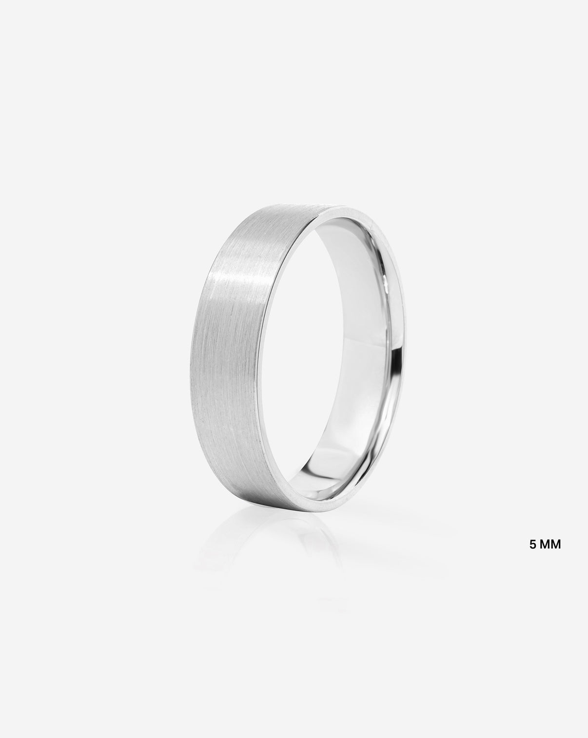 A minimalist 5mm brushed metal band ring in platinum, shown from a side profile on a clean white background with a subtle reflection.