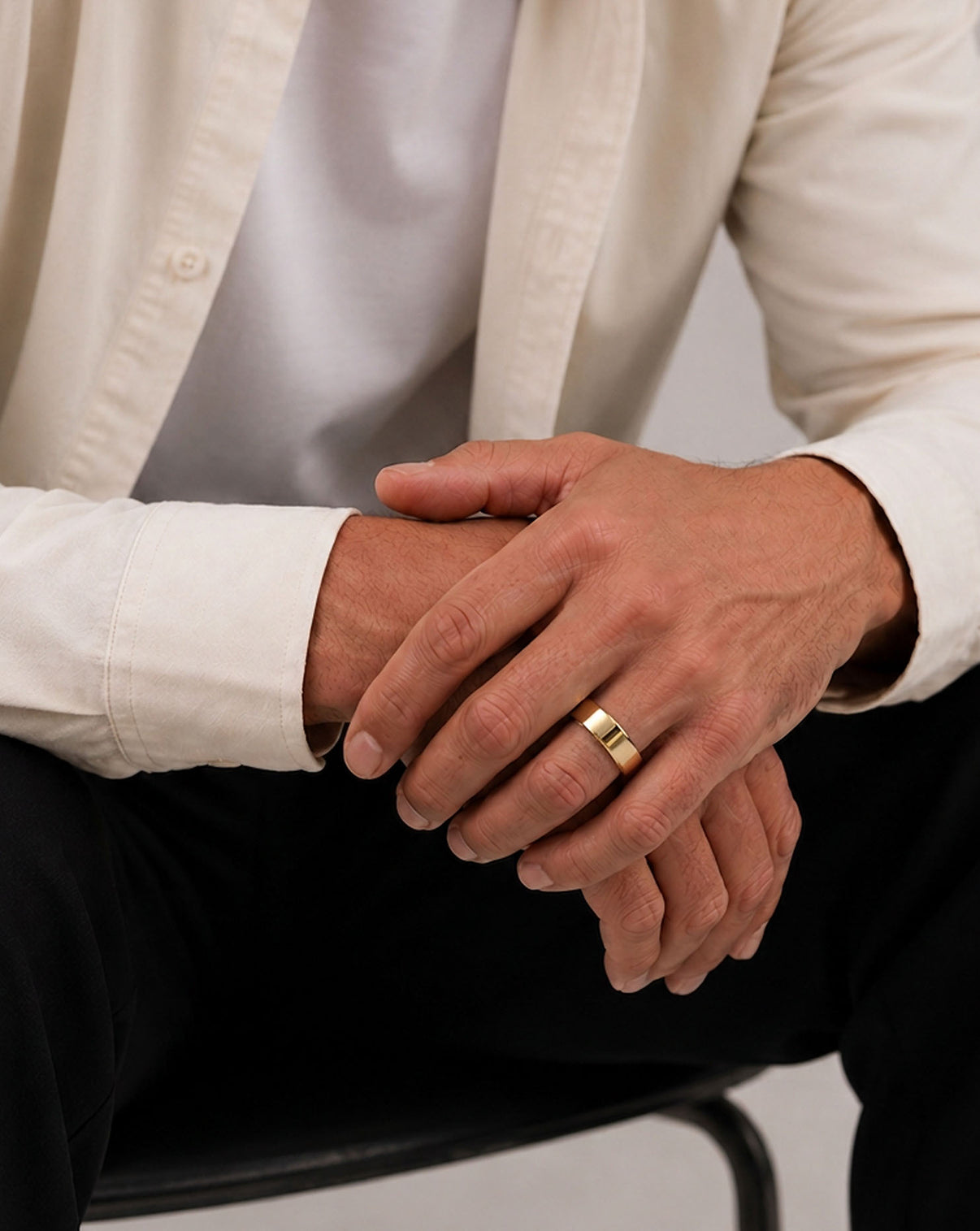 4mm flat wedding band on white background yellow gold on model global