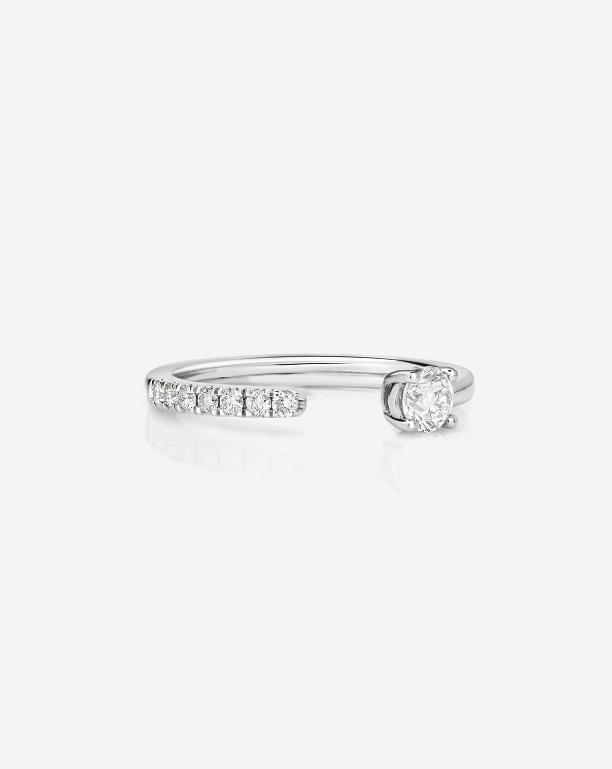 14k white gold open band ring with small diamonds on a white background platinum