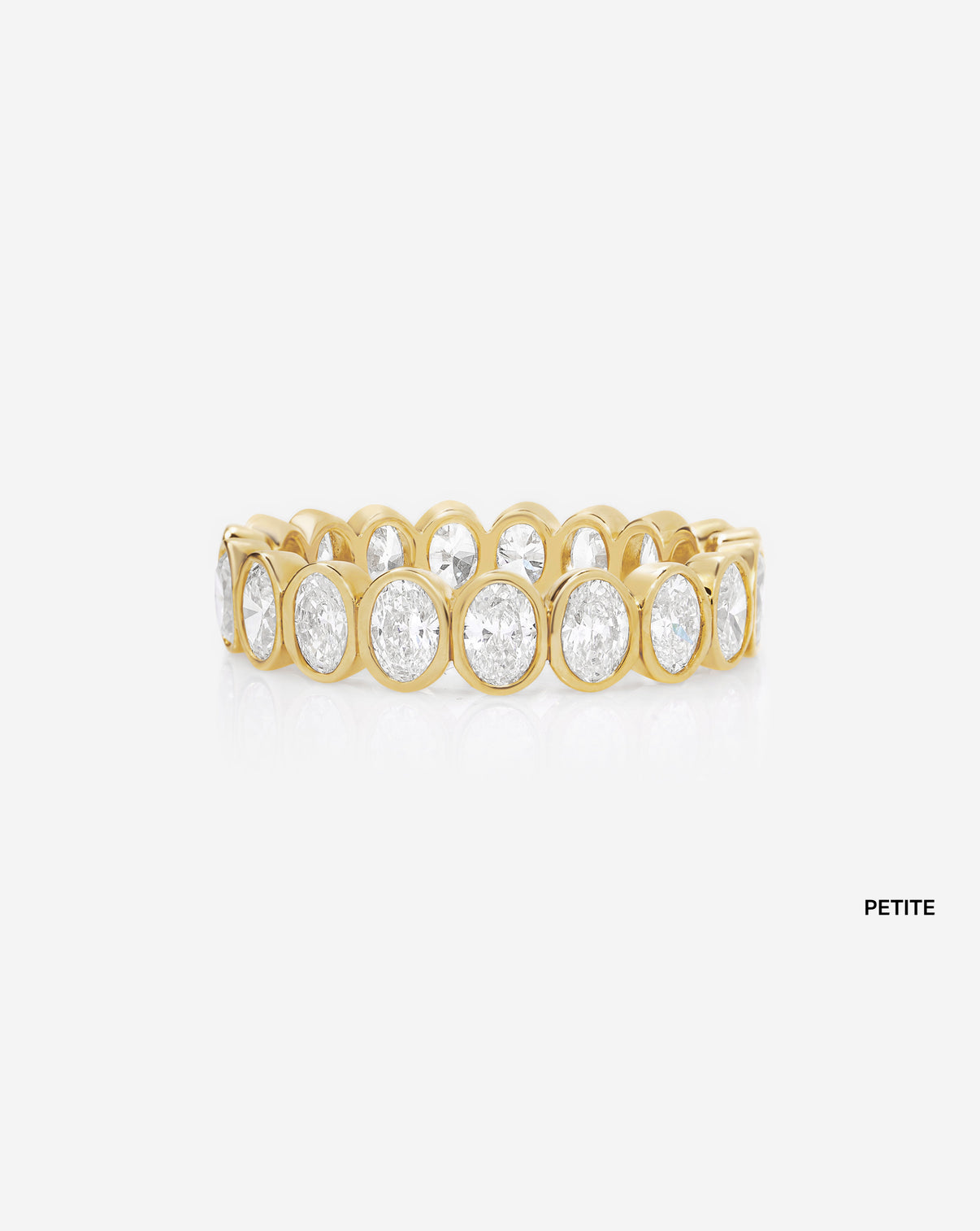 petite oval bezel on white background 14k yellow gold