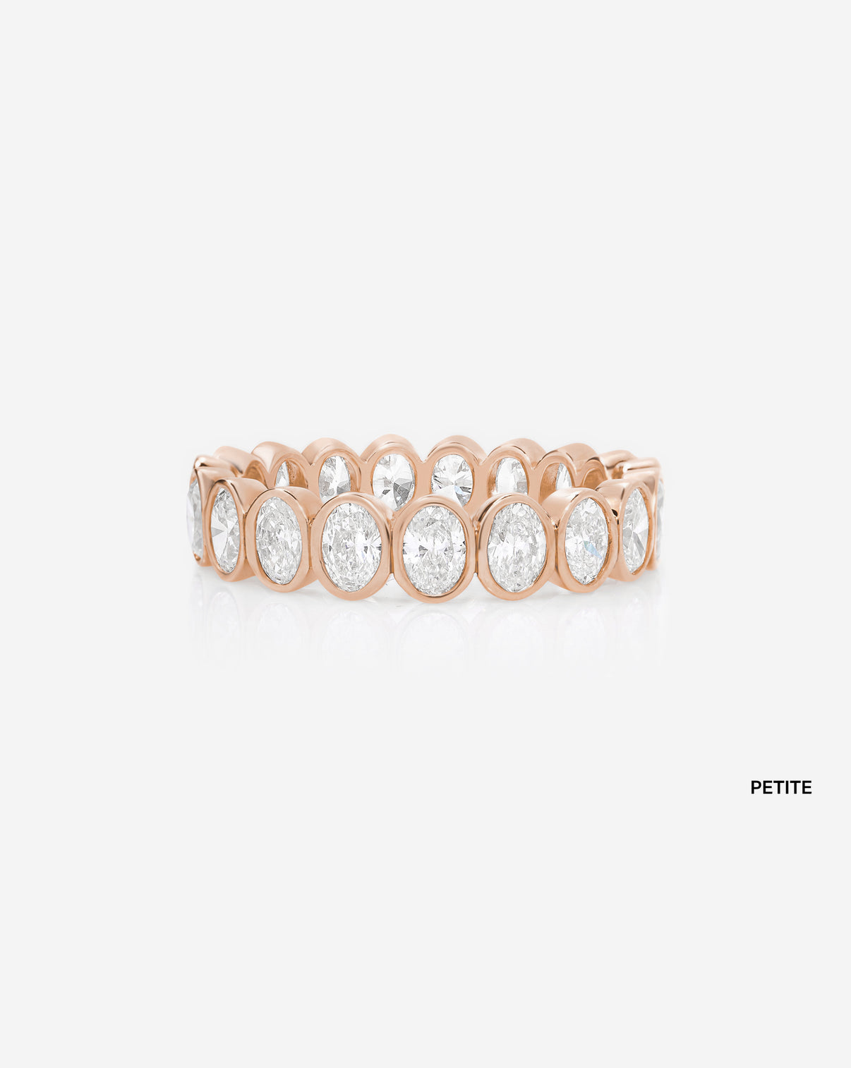 petite oval bezel on white background 14k rose gold