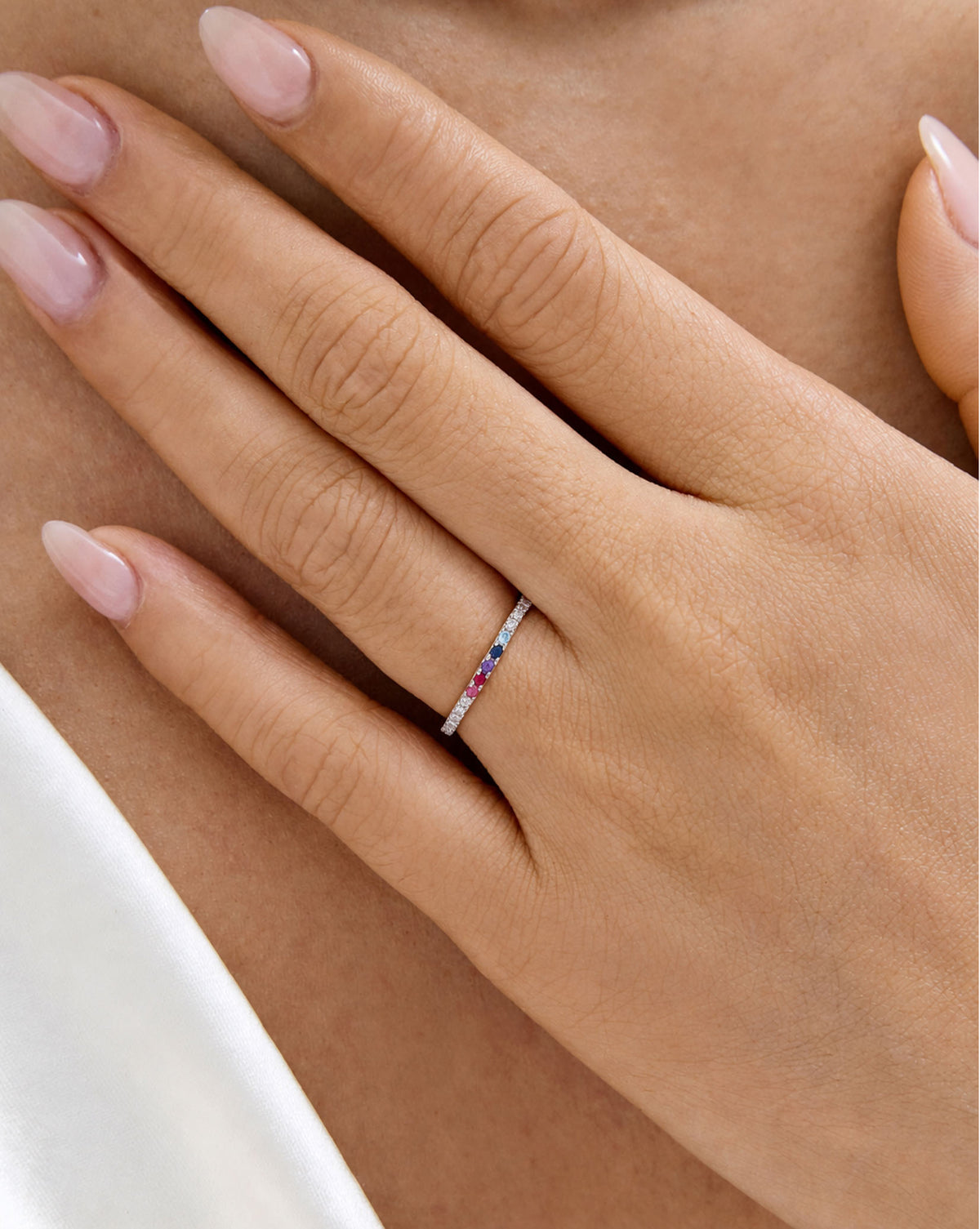 Model wearing 1.3 mm perfect pave with 3 gemstones global
