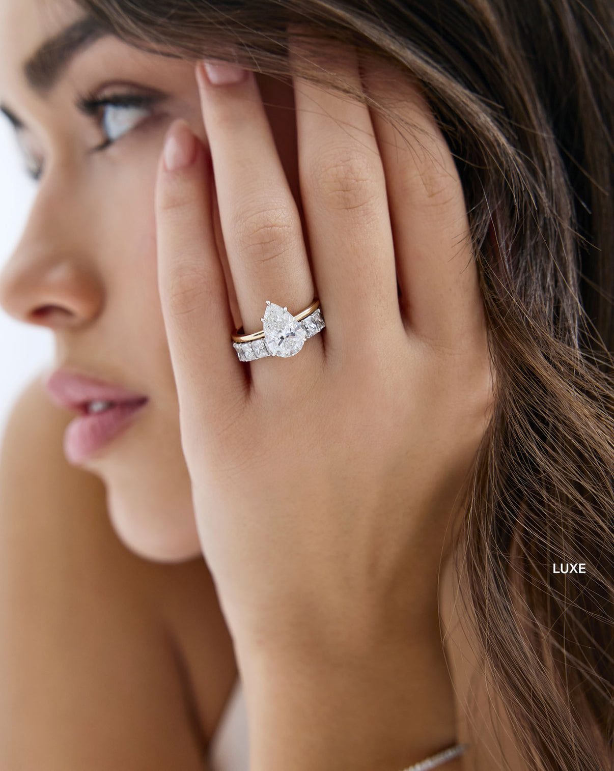 luxe radiant 3/4 wedding band on-model with engagement ring global