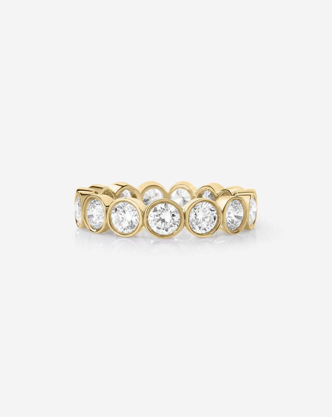 classic round bezel wedding band on white background