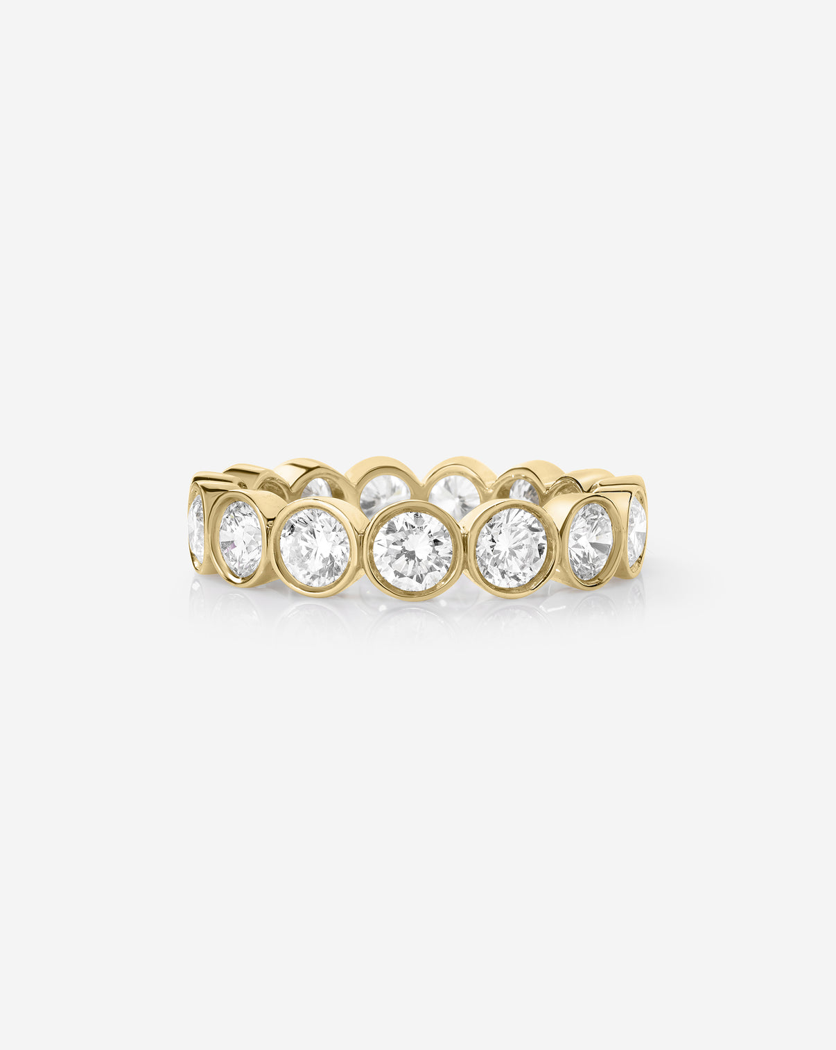 classic round bezel wedding band on white background