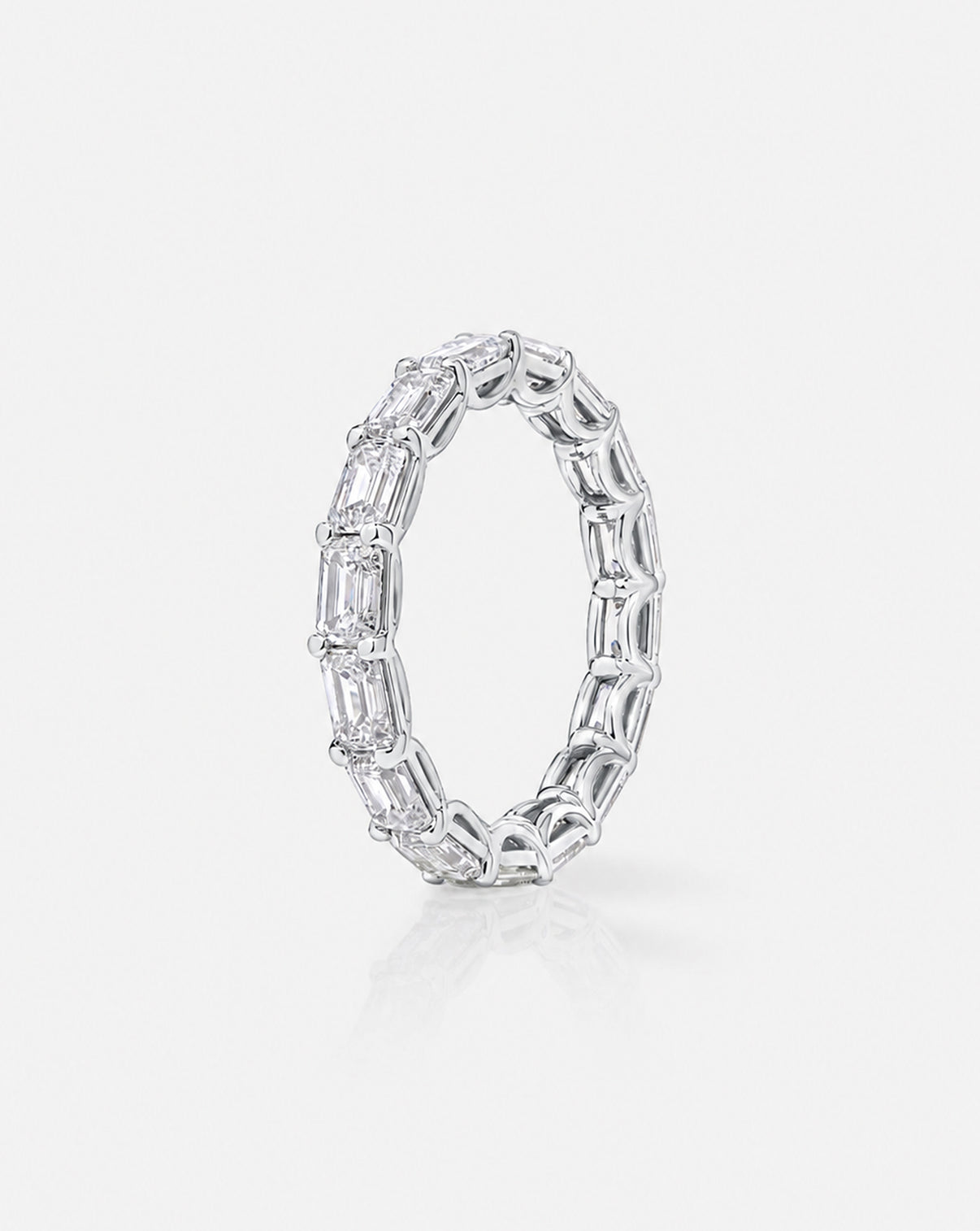 Close-up of  Diamond Sideways Emerald Eternity Band platinum side view