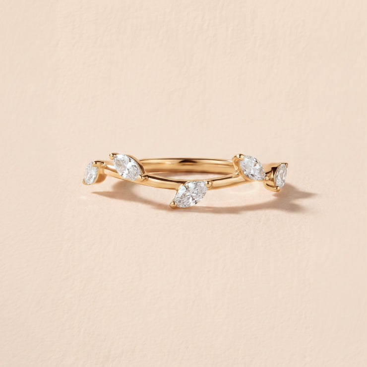 RC's The Vine diamond wedding band against a textured neutral background