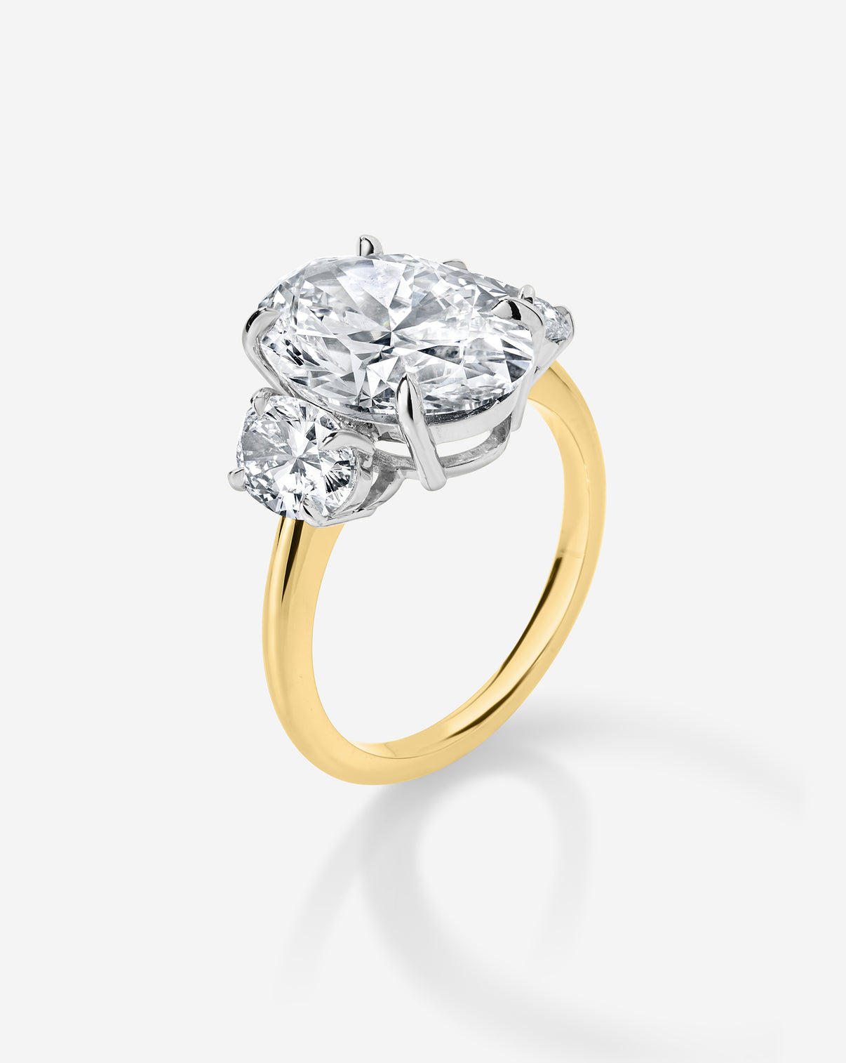 4 carat Oval Whisper Thin Three Stone with Oval | 14k yellow gold w/ platinum prongs ghost still side view