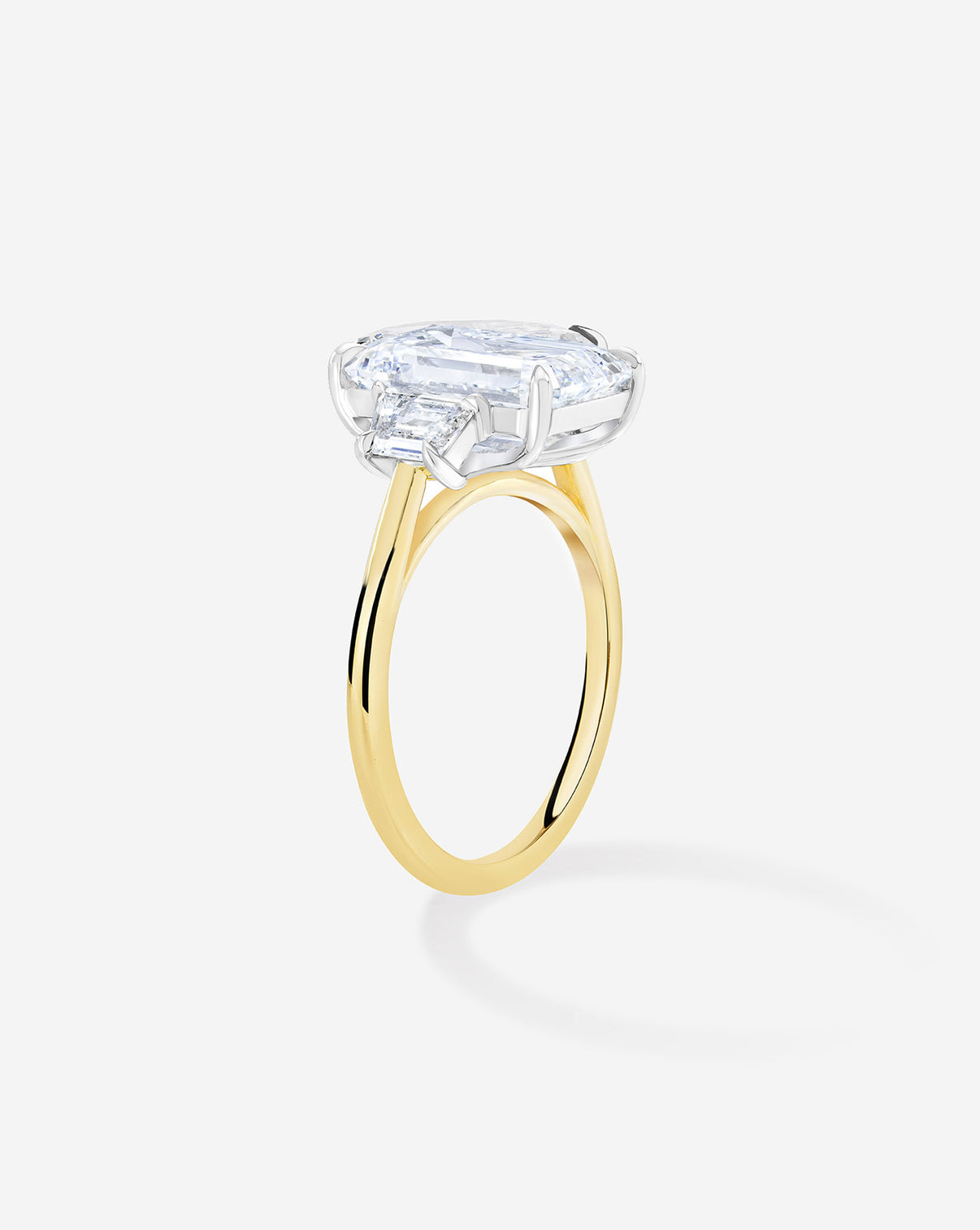 Ring Concierge Engagement Rings 5 carat Emerald in Yellow Gold Whisper Thin with trapezoid side stones side angle