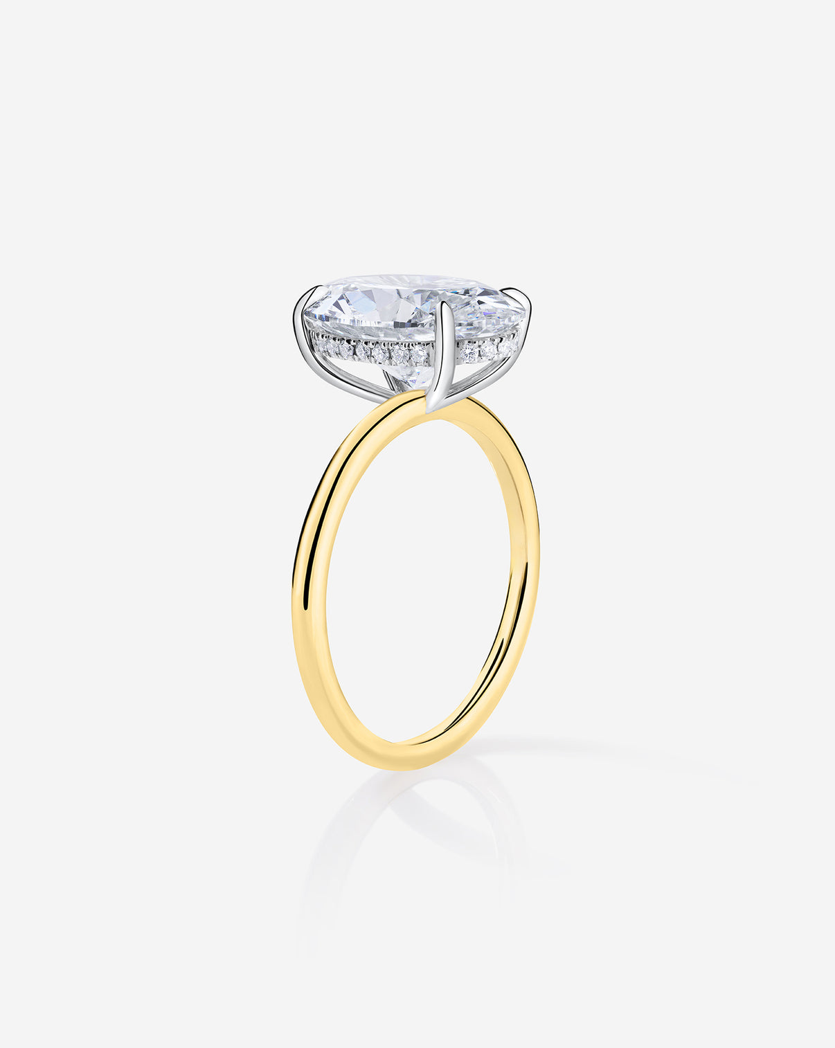 side view showing hidden halo of 3 carat Oval Diamond Engagement Ring in Yellow Gold Whisper Thin Hidden Halo band with Platinum Prongs