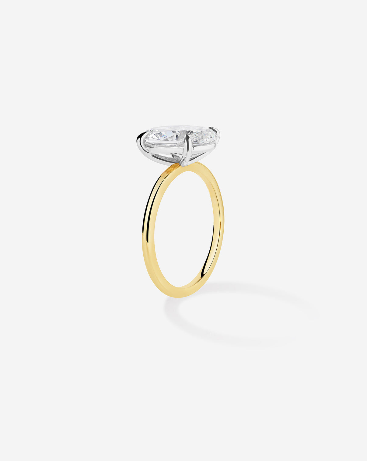 3 carat Oval Diamond Engagement Ring in Yellow Gold Whisper Thin band with Platinum Prongs side view