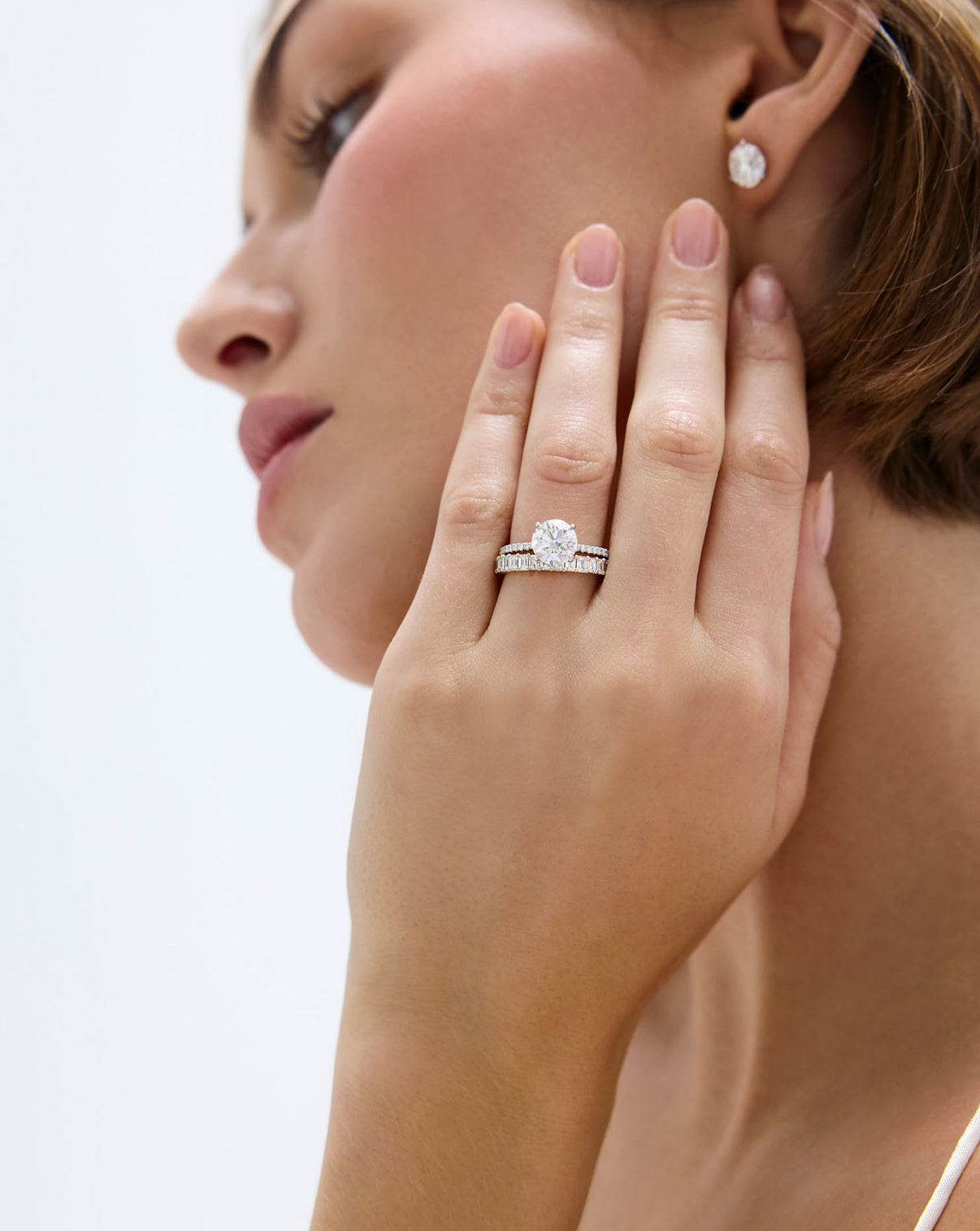 2 carat Round Diamond Engagement Ring in Platinum Pave Hidden Halo Whisper Thin worn on model with a diamond wedding band