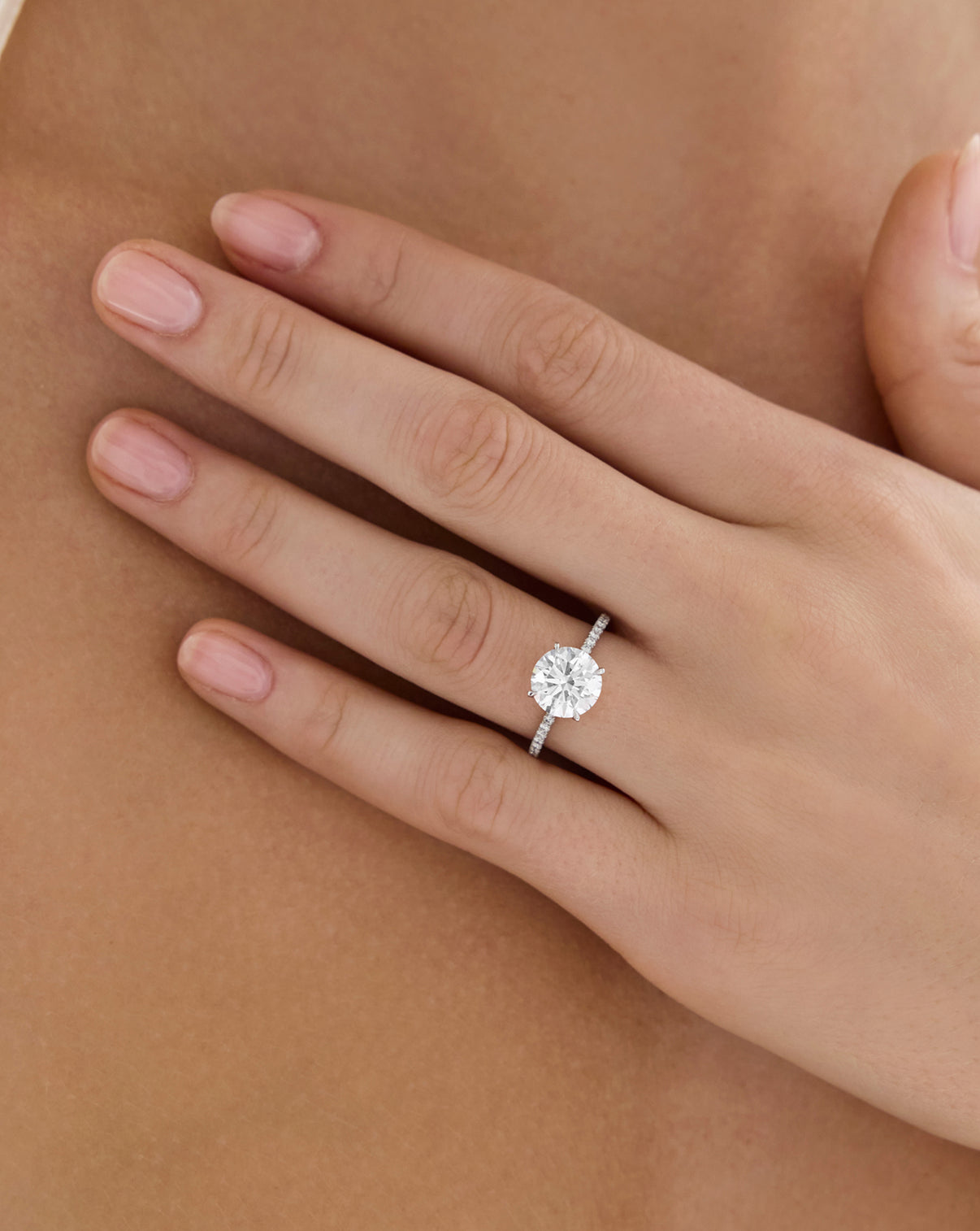 4 carat Round Lab Diamond in Whisper Thin® with Pavé Platinum shown on model's hand