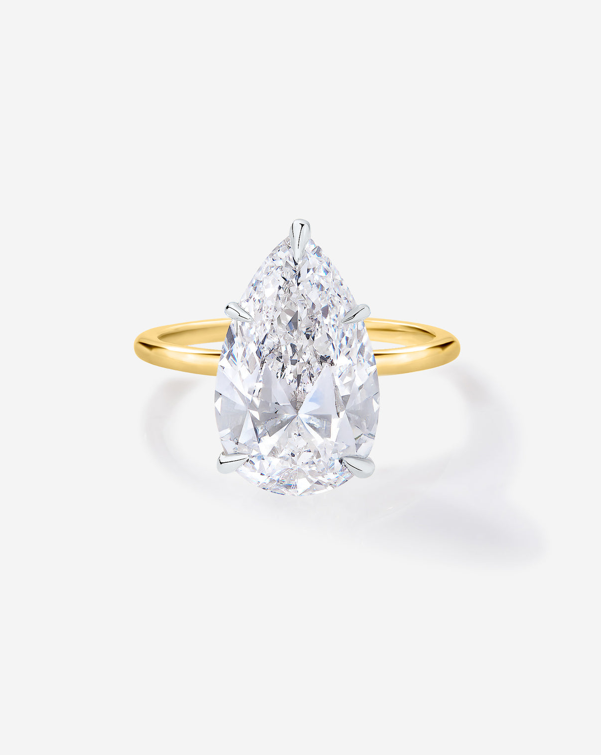Front view of 3 carat Pear diamond engagement ring with Yellow Gold Whisper Thin band and Platinum Prongs