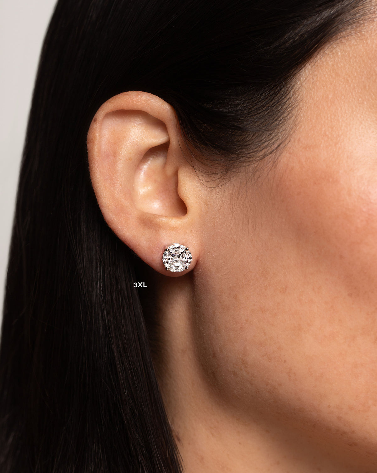 side view of model wearing round illusion diamond studs size 3X