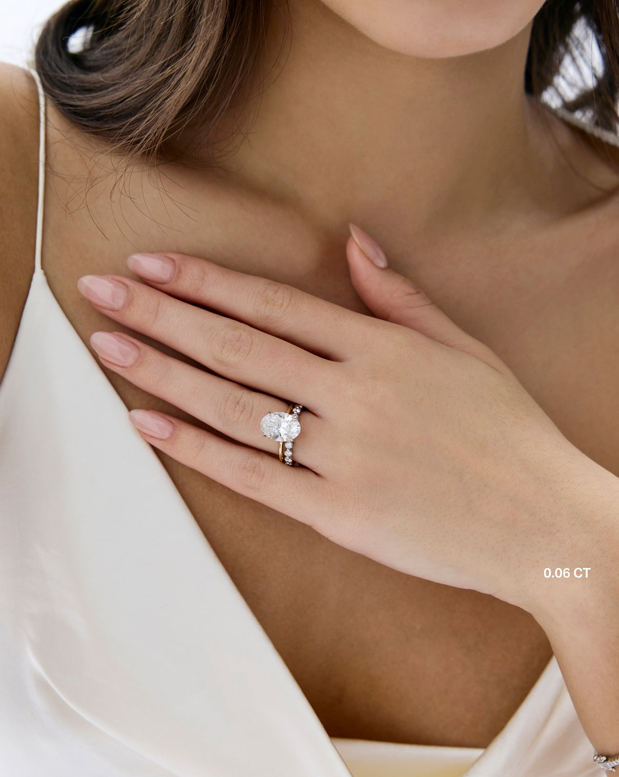 Single Prong Lab Diamond Band in .06 carat weight paired with engagement ring - global