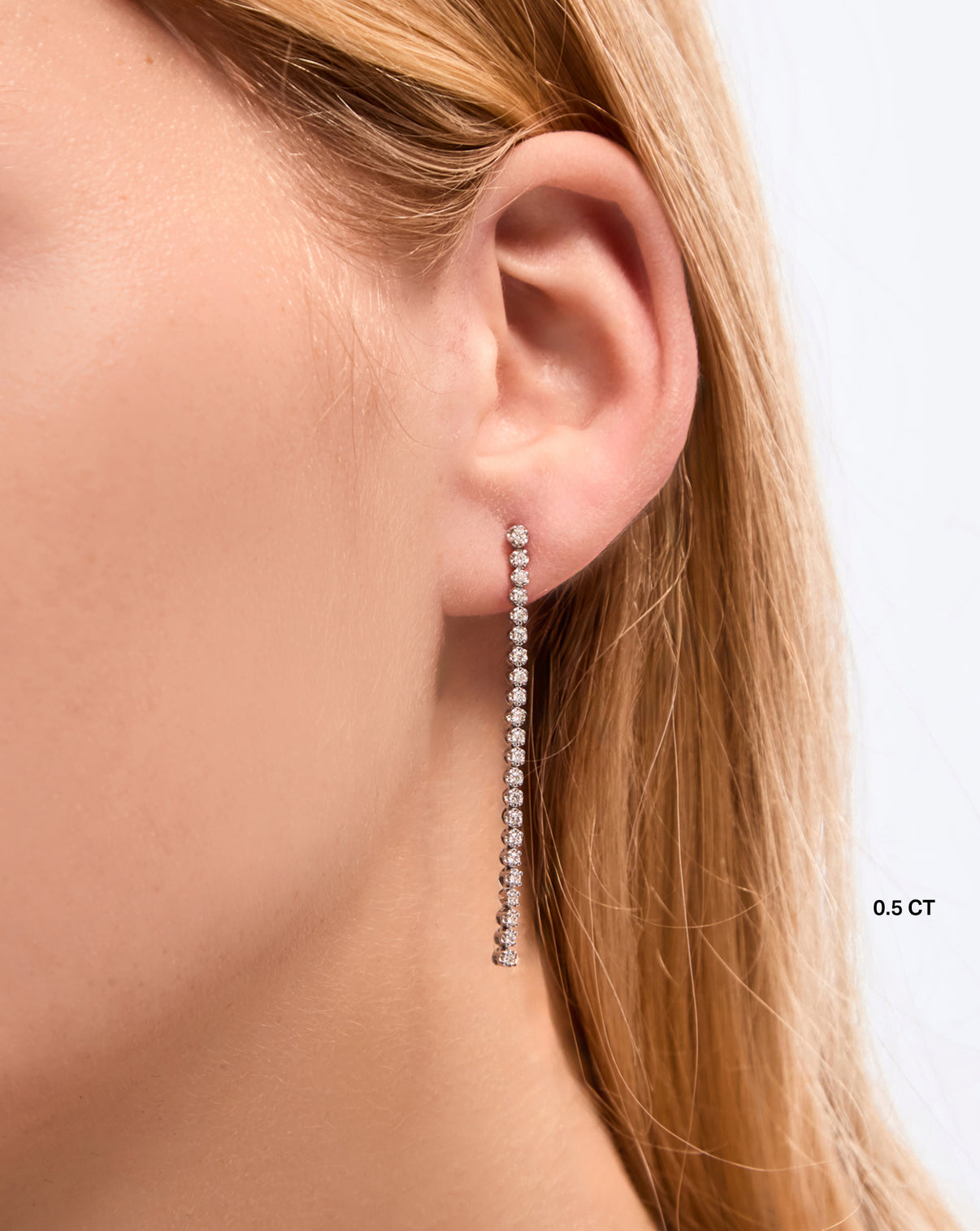 Tennis Trio Earrings 0.5 carat styled solo on model in the front of ear